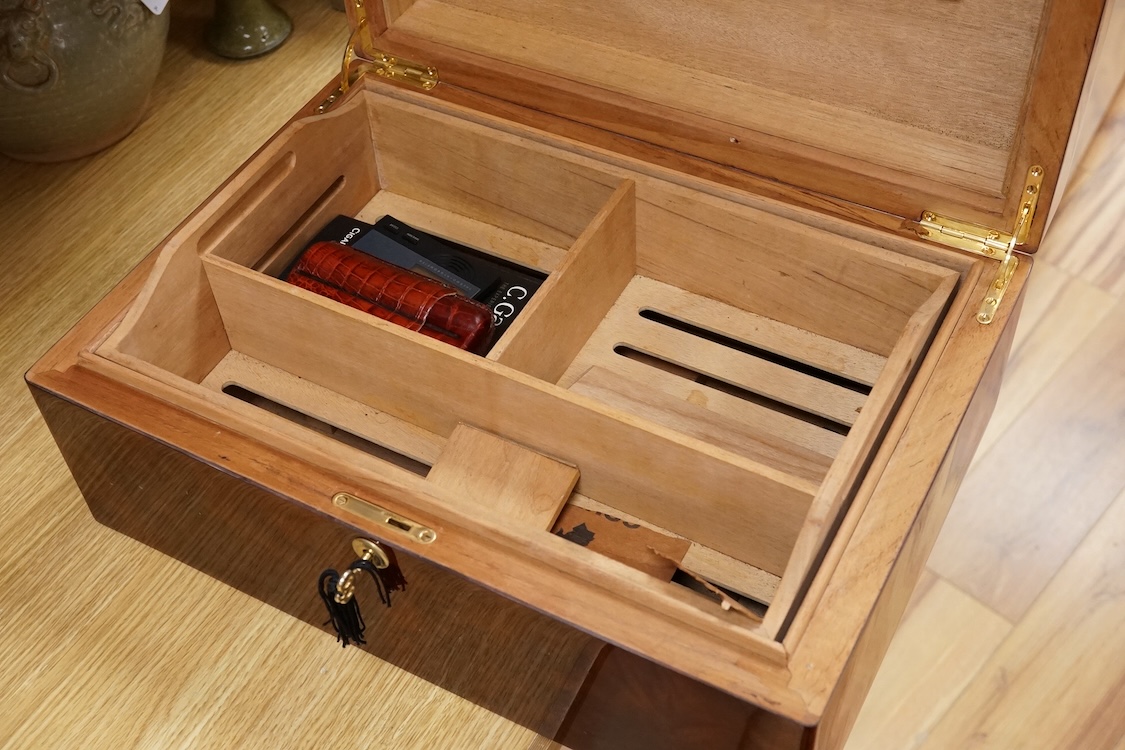 A humidor ‘Hand Made Havana Cigars’, with double cigar pouch, with key, 44cm wide